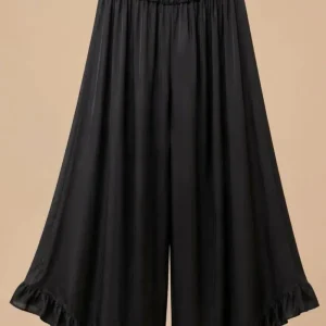 PANTALÓN VOLANTES ASIMÉTRICO NEGRO