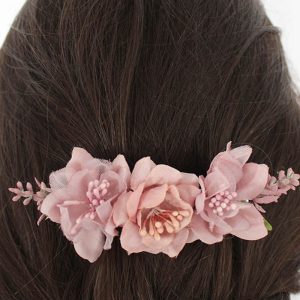 Pasador flores tonos rosas palo niña